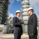 Then-Secretary of Energy Rick Perry (right) joins NRG Energy CEO Mauricio Gutierrez (left) on a tour of the Petra Nova carbon capture and enhanced oil recovery system on Thursday, April 13, 2017. The plant closed less than four years after this photo was taken.